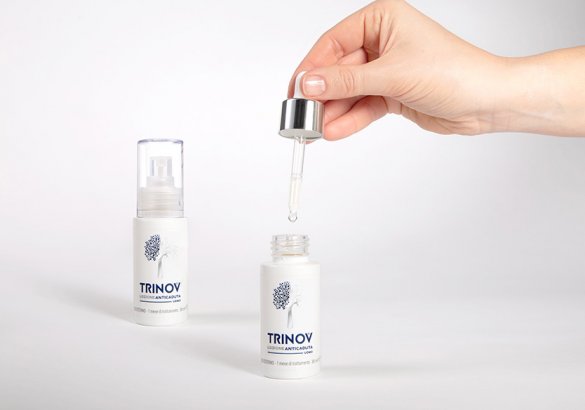 How should Trinov hair loss lotion be applied?